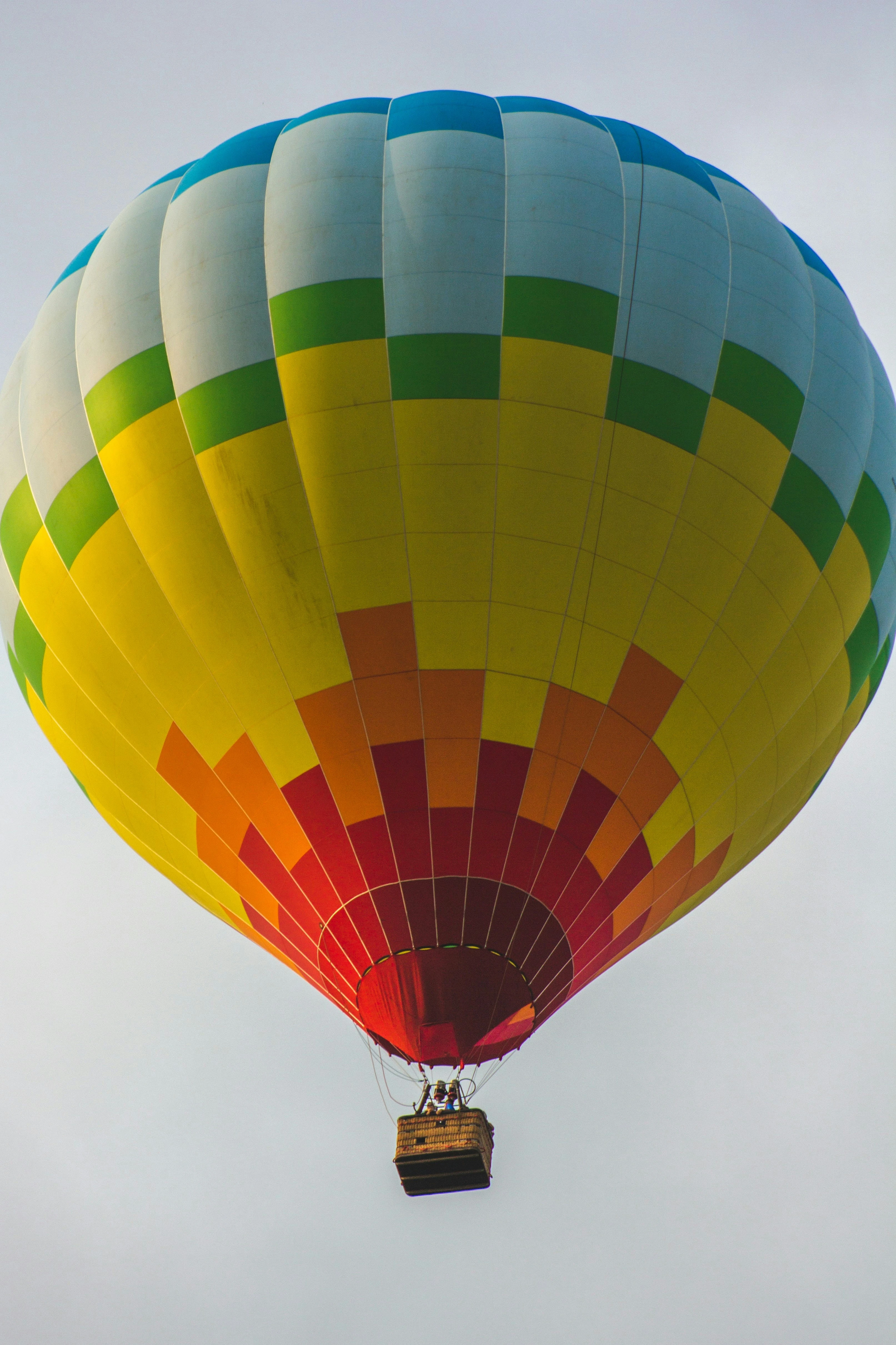 Tethered hot air balloon lifting off from the meadow at sunrise at Shiloh Echo